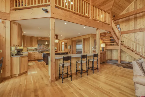 a view of dining room with furniture and wooden floor