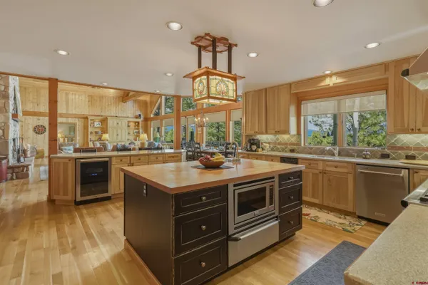 a kitchen with stainless steel appliances granite countertop a stove and a sink