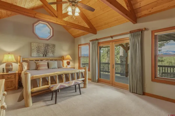 a bedroom with furniture and a window