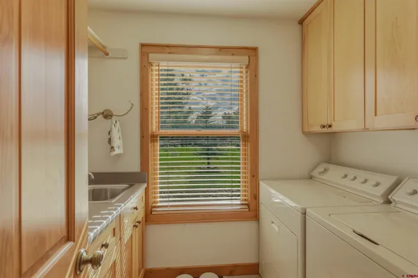 a bathroom with a shower and a sink