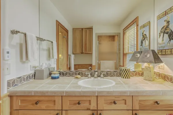 a bathroom with a sink and a mirror
