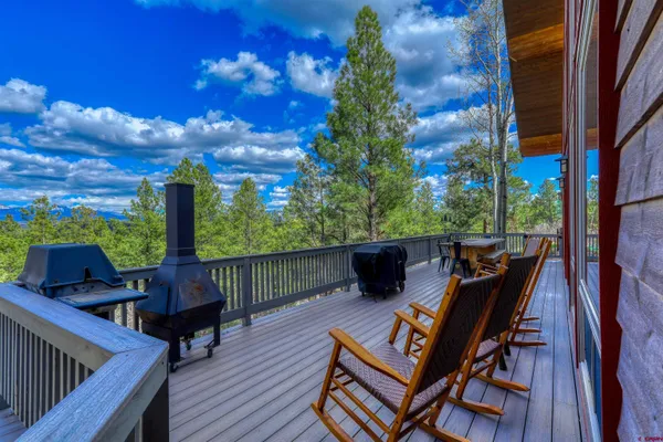 a view of a patio with wooden floor