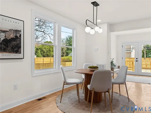 a kitchen with stainless steel appliances granite countertop a sink a stove and a microwave