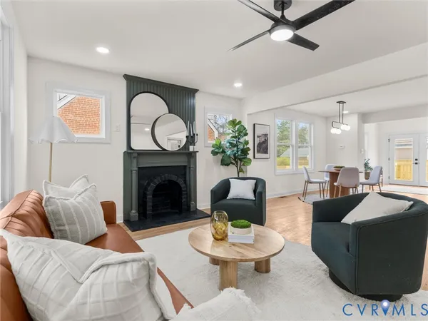 a view of a livingroom with furniture and wooden floor
