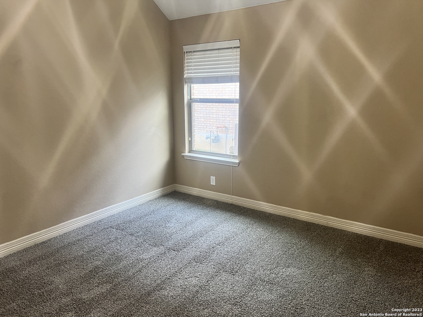 2431 Tremonto San Antonio, TX 78261 - Photo 14 of 21 a view of an empty room with a window