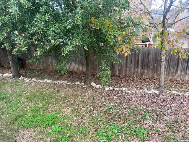 a backyard of a house with lots of green space
