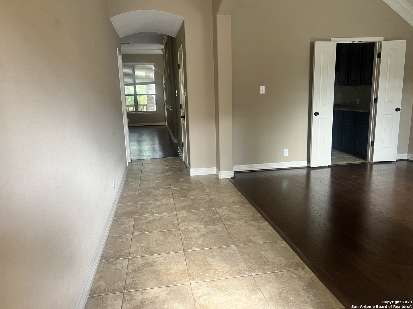 2431 Tremonto San Antonio, TX 78261 - Photo 2 of 21 a view of a hallway with wooden floor and a living room