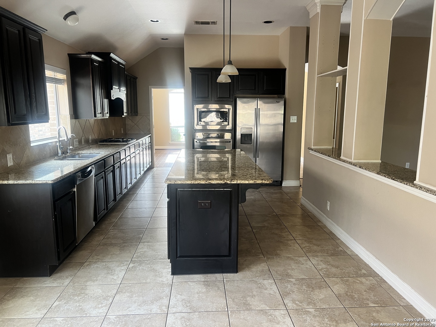 2431 Tremonto San Antonio, TX 78261 - Photo 6 of 21 a kitchen with stainless steel appliances granite countertop a refrigerator a sink and a stove
