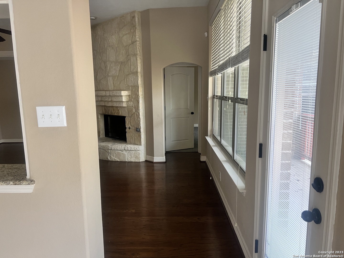 2431 Tremonto San Antonio, TX 78261 - Photo 7 of 21 a view of a hallway with wooden floor and staircase