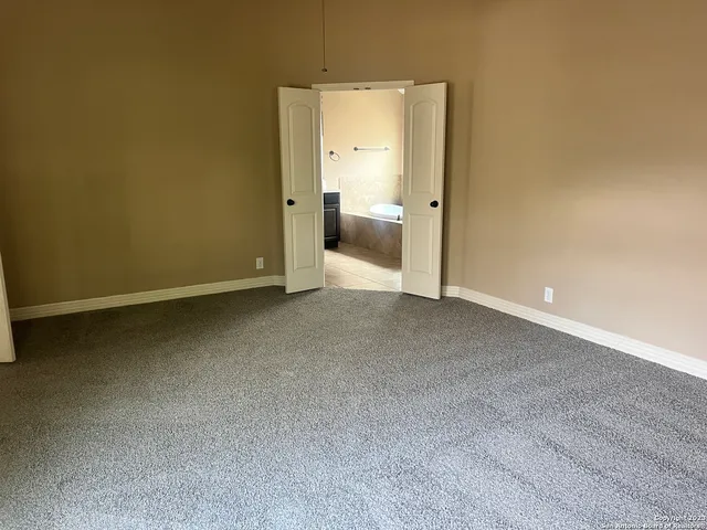 an empty room with a bathroom