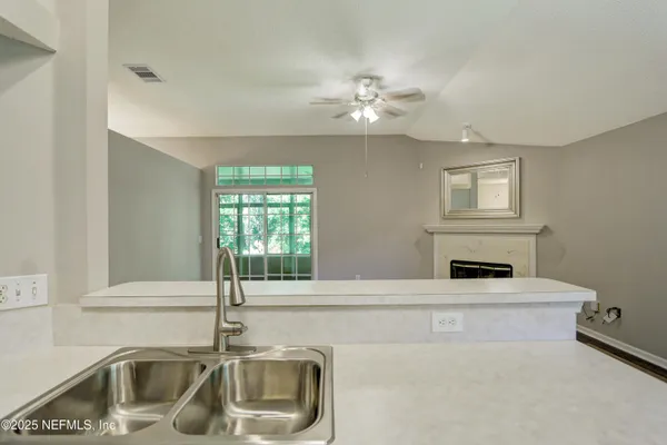 a bathroom with a sink and a window