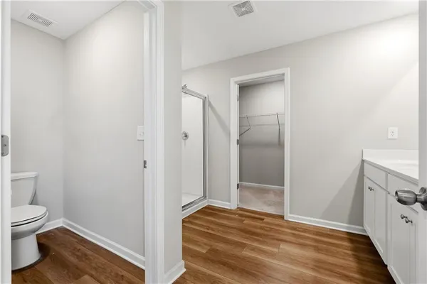 a bathroom with a double vanity sink and mirror
