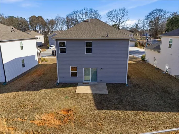 an aerial view of a house with a lake view