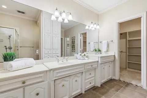 a bathroom with a double vanity sink mirror and double