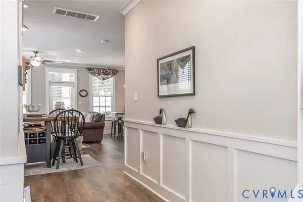 a dining room with furniture and a chandelier