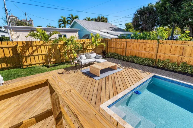 a view of a patio with a table and chairs