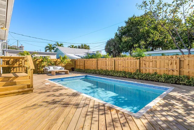 a view of swimming pool with seating space