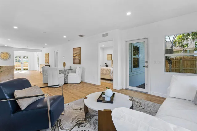a living room with furniture and a table