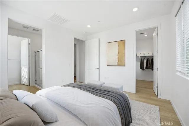 a bedroom with a bed and a couch