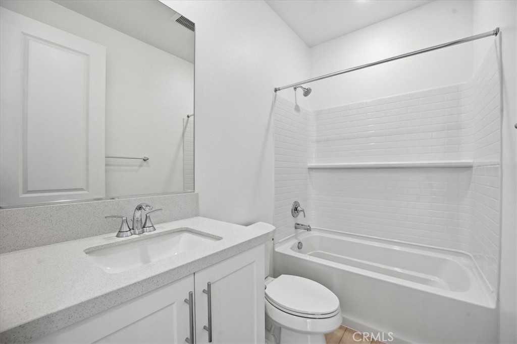 9324 Via Azul Pico Rivera, CA 90660 - Photo 20 of 33 a bathroom with a granite countertop sink a toilet and shower