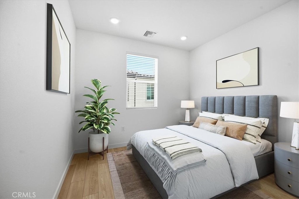9324 Via Azul Pico Rivera, CA 90660 - Photo 21 of 33 a bedroom with bed and a potted plant