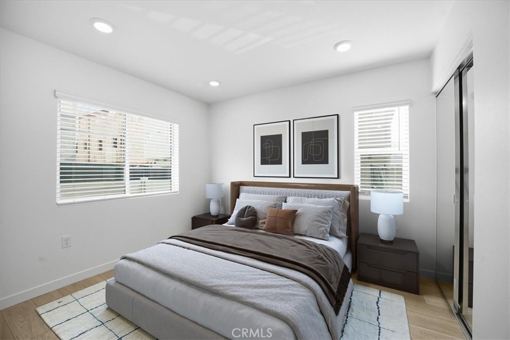 9324 Via Azul Pico Rivera, CA 90660 - Photo 24 of 33 a bedroom with a large bed and a window