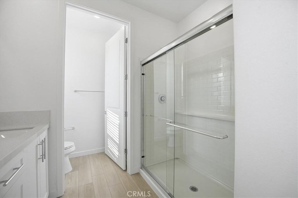 9324 Via Azul Pico Rivera, CA 90660 - Photo 26 of 33 a bathroom with a glass shower door