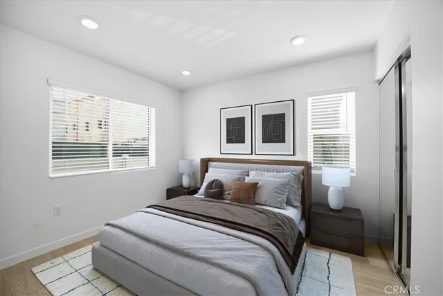 a bedroom with bed and a window