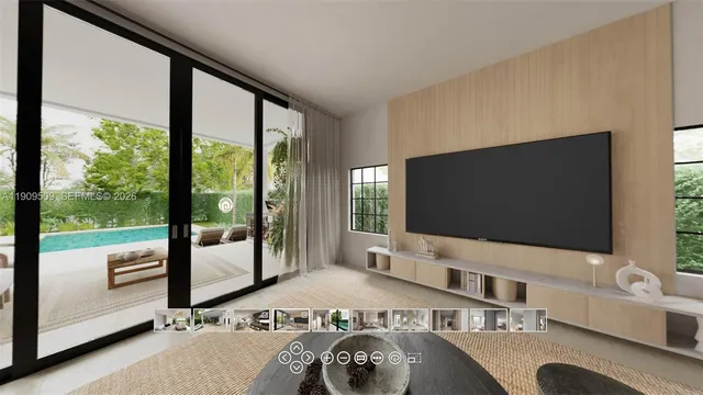 a living room with a large window and a flat screen tv