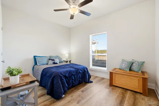 a bedroom with a bed and a bookshelf