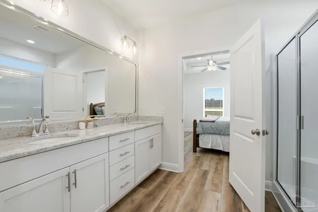 a bathroom that has a glass shower door
