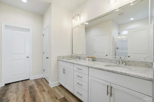 a bedroom with a bed and a ceiling fan