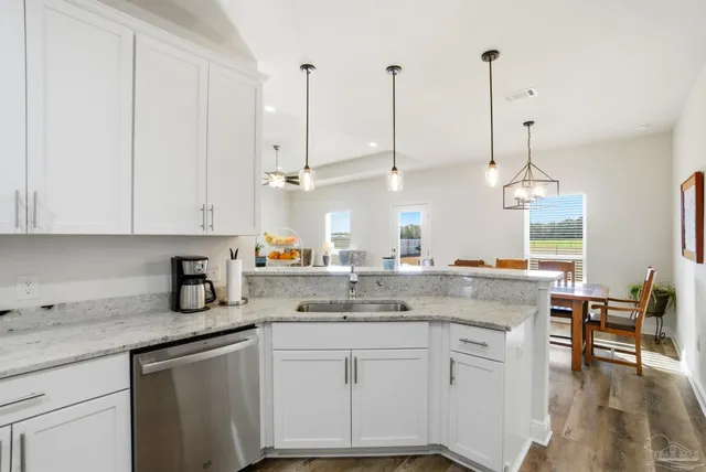 a kitchen with a refrigerator sink and microwave