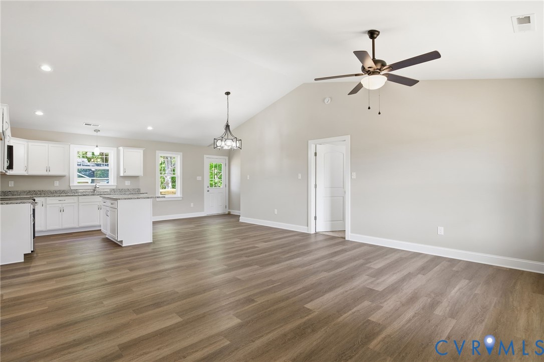 17557 Hewlett Road Beaverdam, VA 23015 - Photo 5 of 29 a view of a kitchen with wooden floor and a ceiling fan