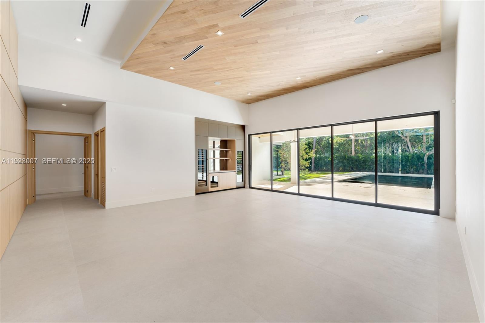 6840 Southwest 92nd Street Pinecrest, FL 33156 - Photo 15 of 42 a view of an empty room with a balcony