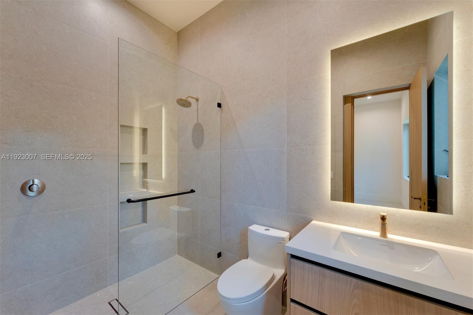 6840 Southwest 92nd Street Pinecrest, FL 33156 - Photo 26 of 42 a bathroom with a sink a toilet and shower