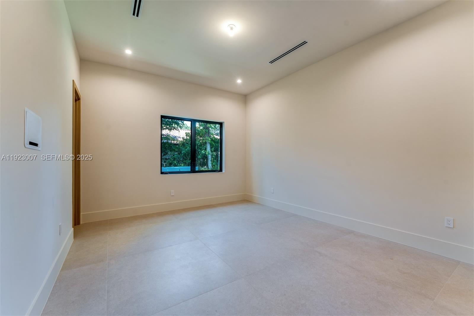 6840 Southwest 92nd Street Pinecrest, FL 33156 - Photo 29 of 42 an empty room with windows