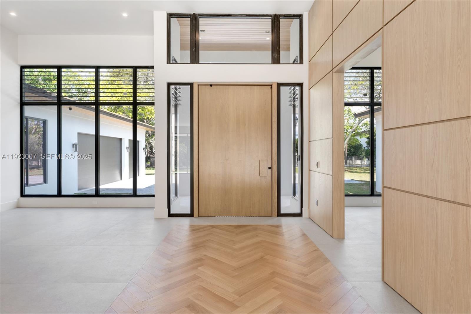 6840 Southwest 92nd Street Pinecrest, FL 33156 - Photo 3 of 42 a view of a large window with an outdoor space