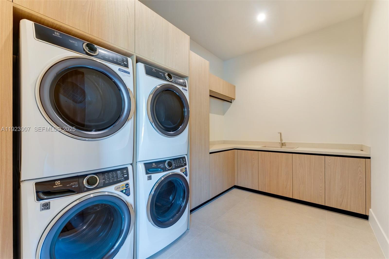 6840 Southwest 92nd Street Pinecrest, FL 33156 - Photo 31 of 42 a view of a storage & utility room with a washer dryer