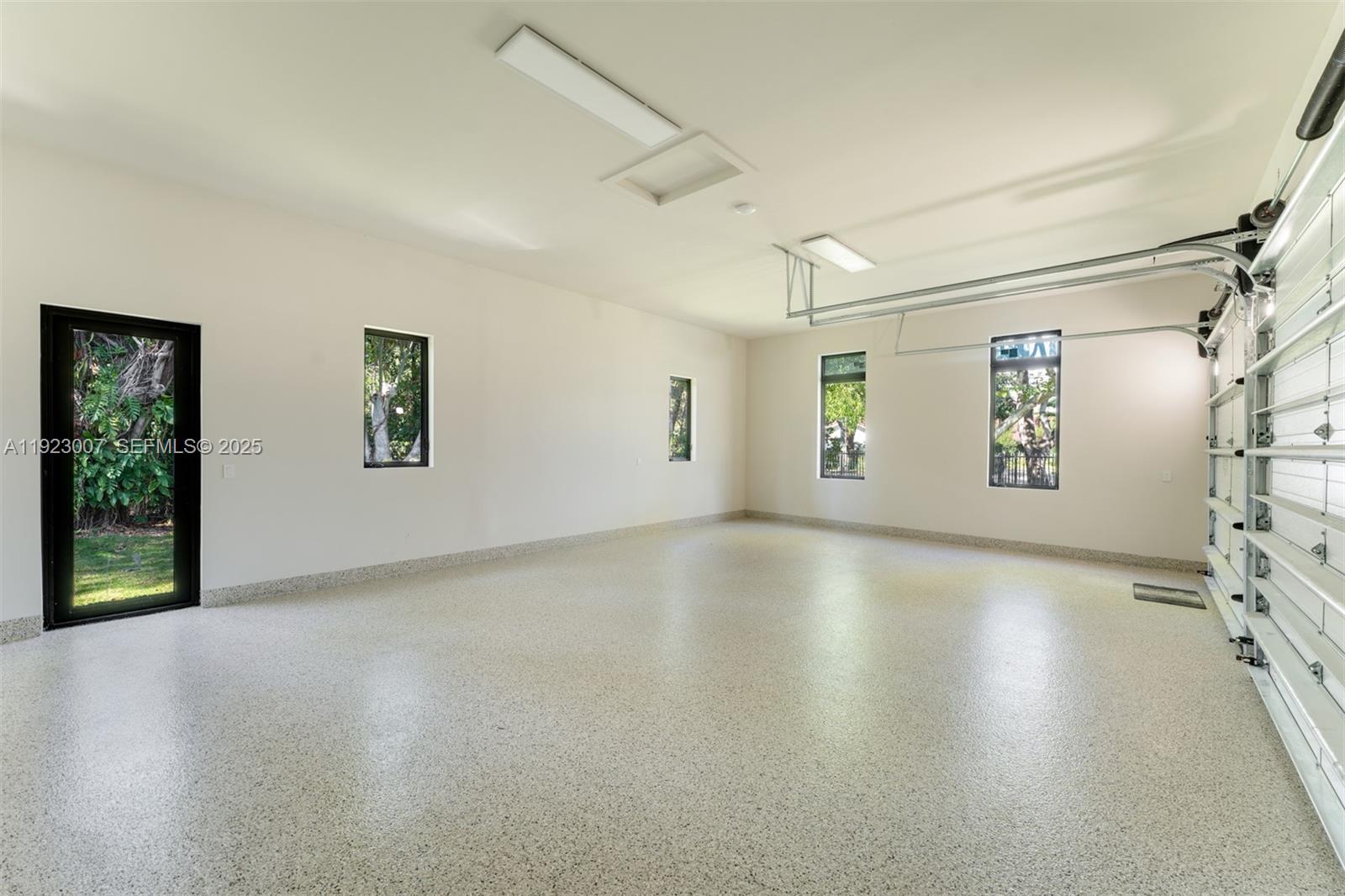 6840 Southwest 92nd Street Pinecrest, FL 33156 - Photo 32 of 42 a view of a livingroom with window and wooden floor
