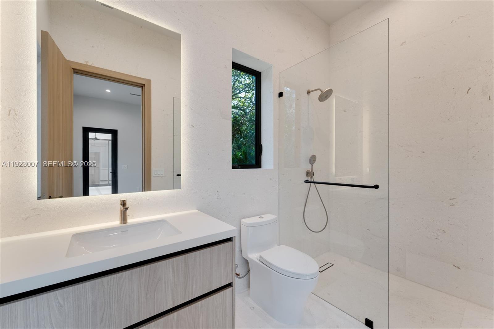 6840 Southwest 92nd Street Pinecrest, FL 33156 - Photo 38 of 42 a bathroom with a sink a toilet and shower