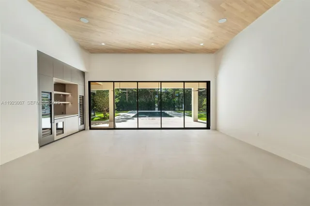 a view of an empty room with a large window