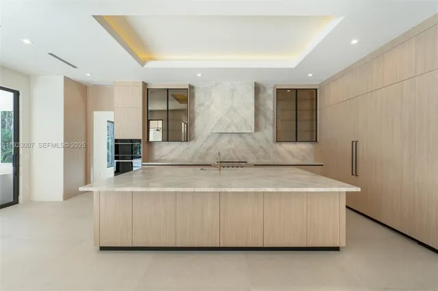 a view of living room with furniture and refrigerator