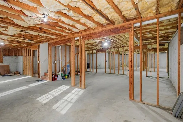 a view of a room with wooden walls