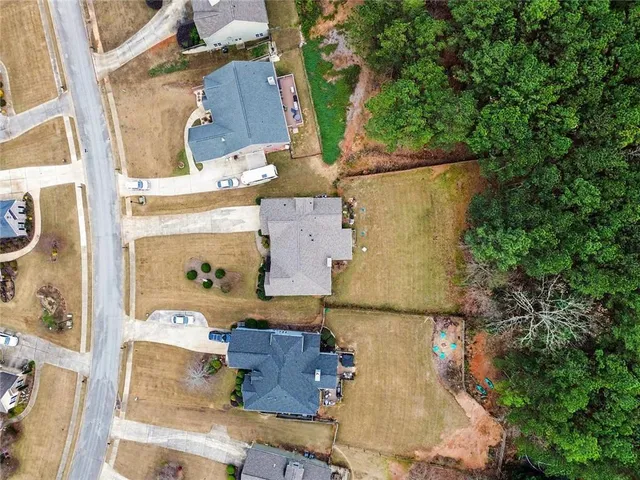 an aerial view of residential house with outdoor space