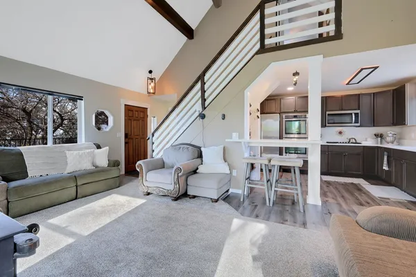 a kitchen with a sink stove and microwave