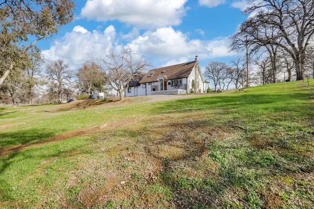 a view of a patio with table and chairs