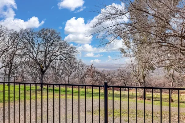 a balcony with wooden floor in back