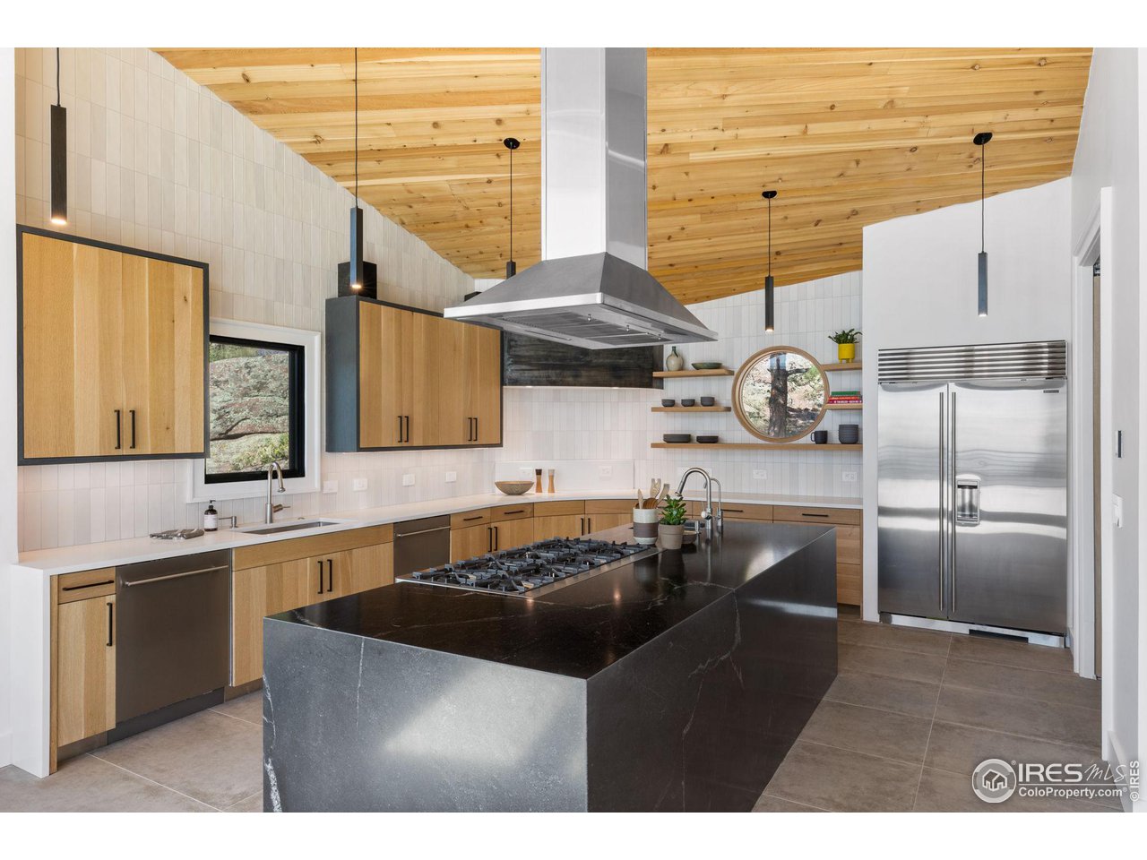 855 Timber Lane Boulder, CO 80304 - Photo 12 of 40 a kitchen with stainless steel appliances granite countertop a sink a stove and a refrigerator