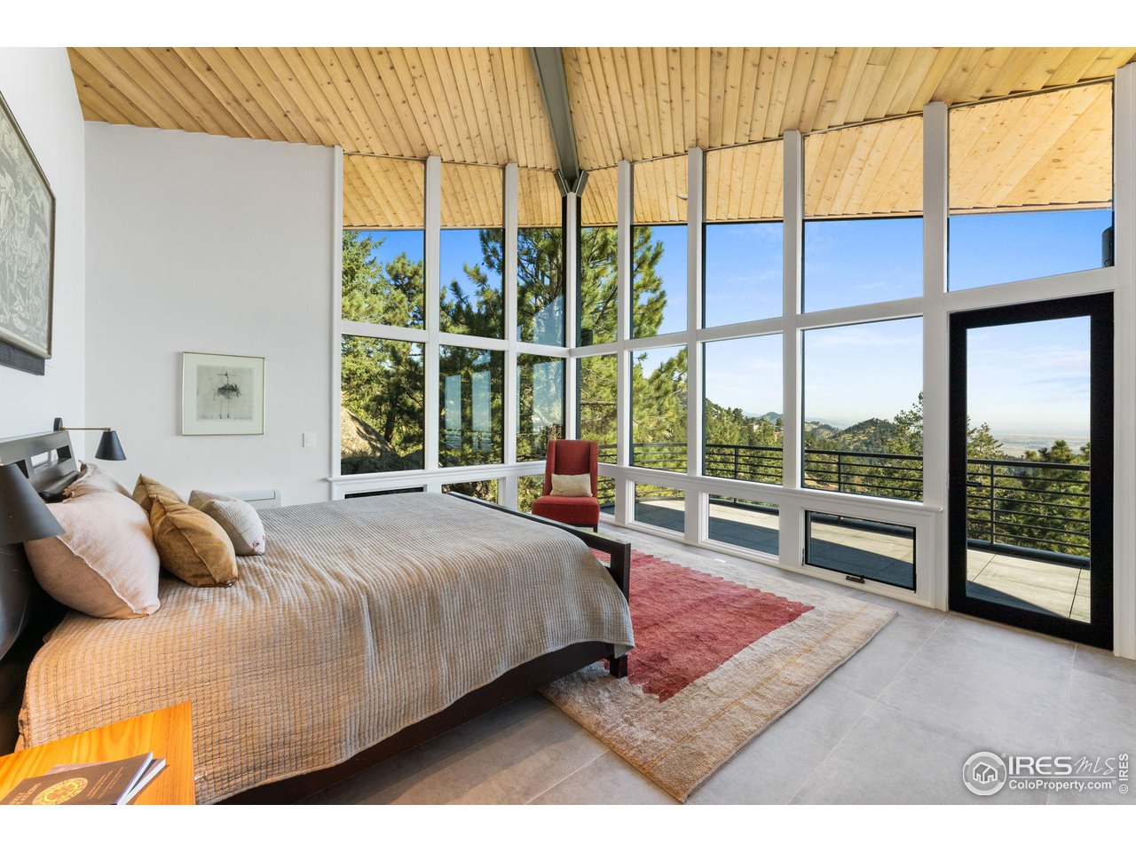 855 Timber Lane Boulder, CO 80304 - Photo 23 of 40 a bedroom with a bed and a night stand